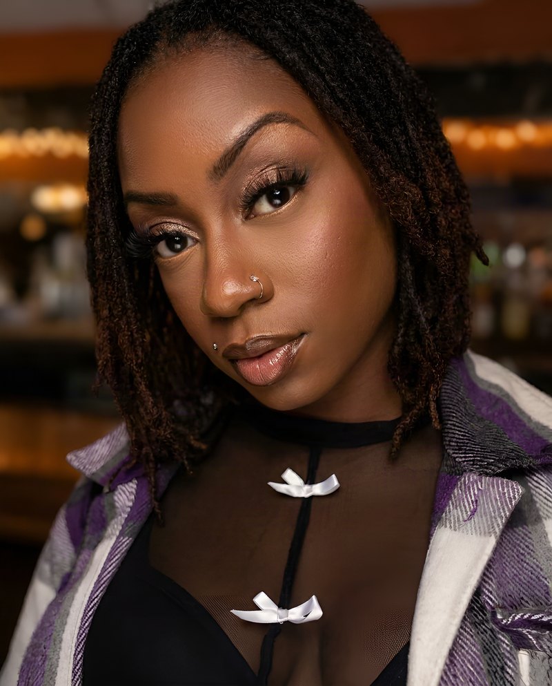 Janay Lewis, party mode: sheer black, silver bows