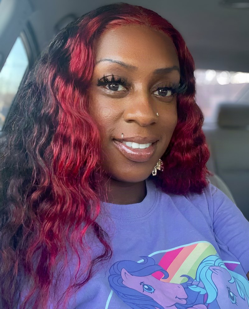Janay Lewis wearing Red peekaboo waves