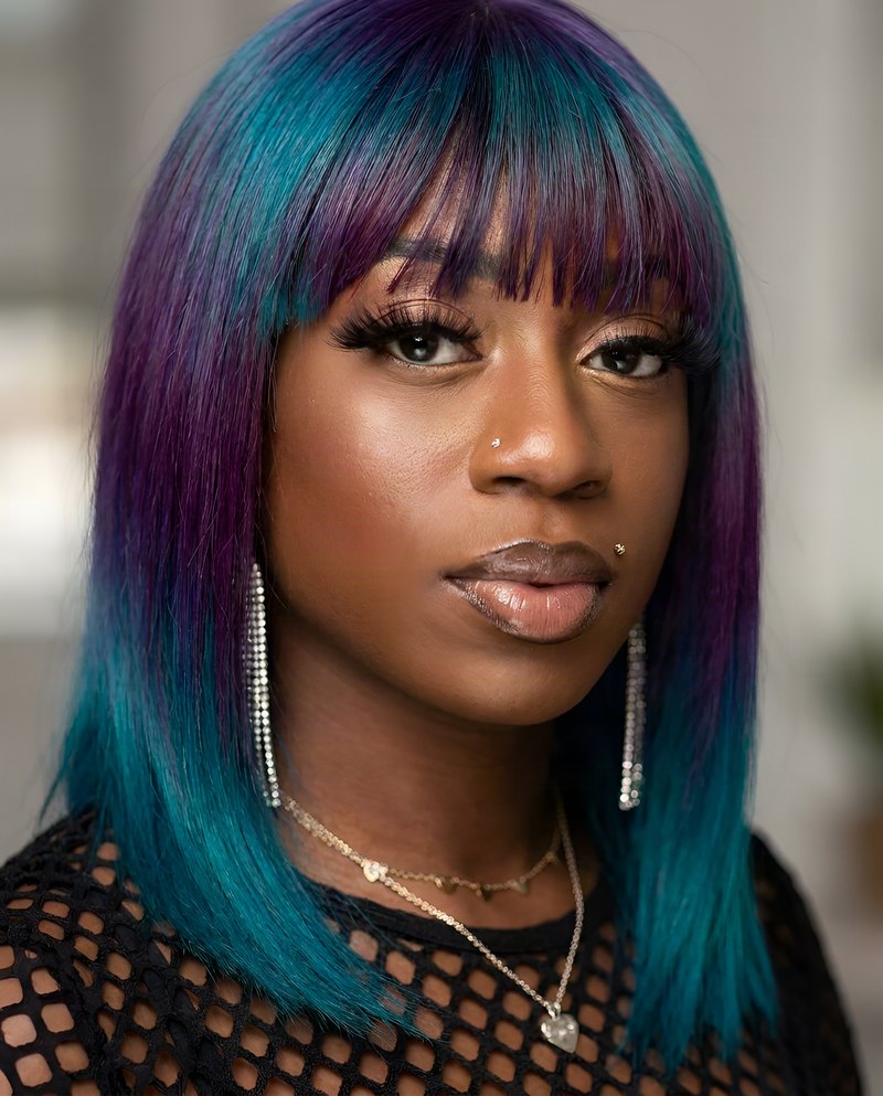 Janay Lewis wearing Violet & teal bob