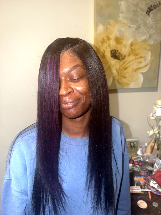 Same client after, long straight hair with purple highlights