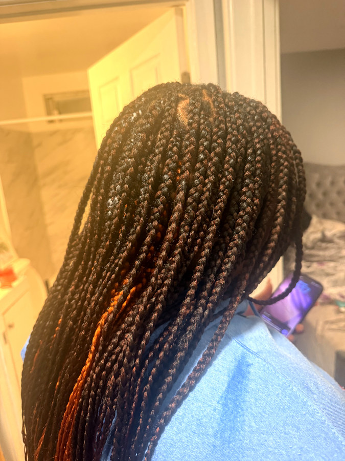 Long knotless braids with copper strands