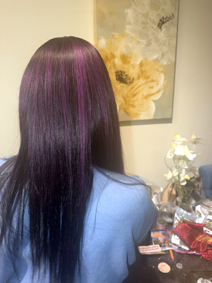 Sleek straight hair with purple highlights